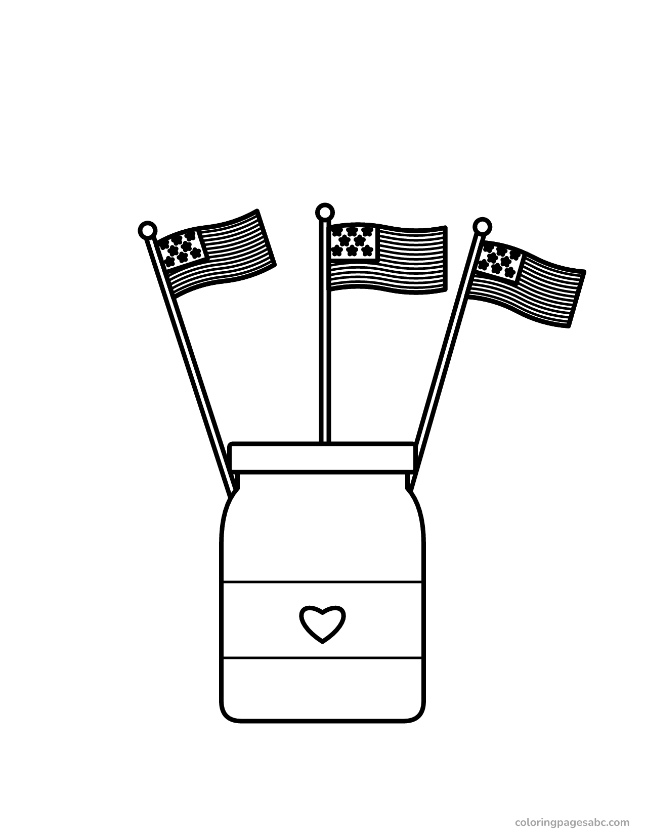Three little American flags standing in a jar with a heart