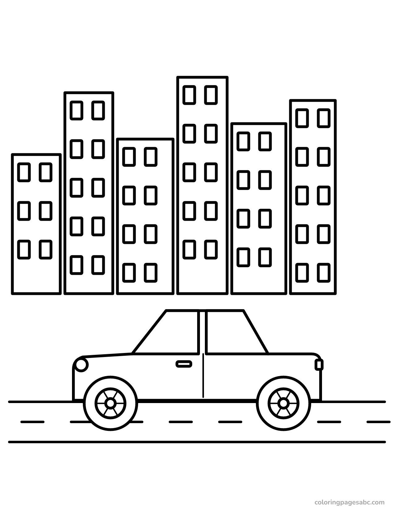Car driving on a city street in front of tall buildings